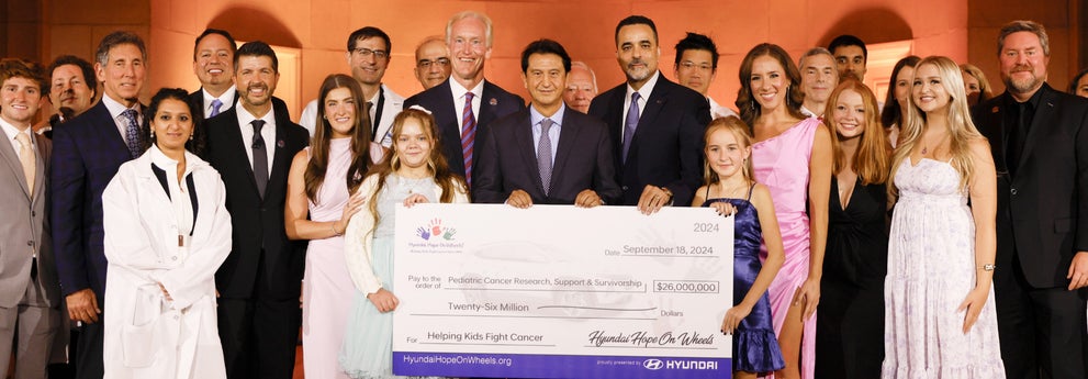 helping kids fight cancer foundation showing their big check from hyundai hope on wheels - Chico Hyundai in Chico CA